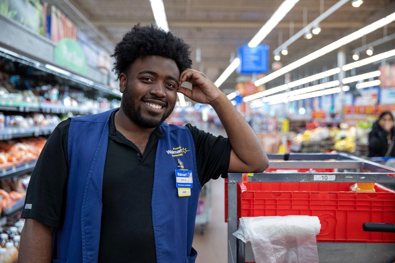 A Walmart Canada team member arranging fresh produce in-store